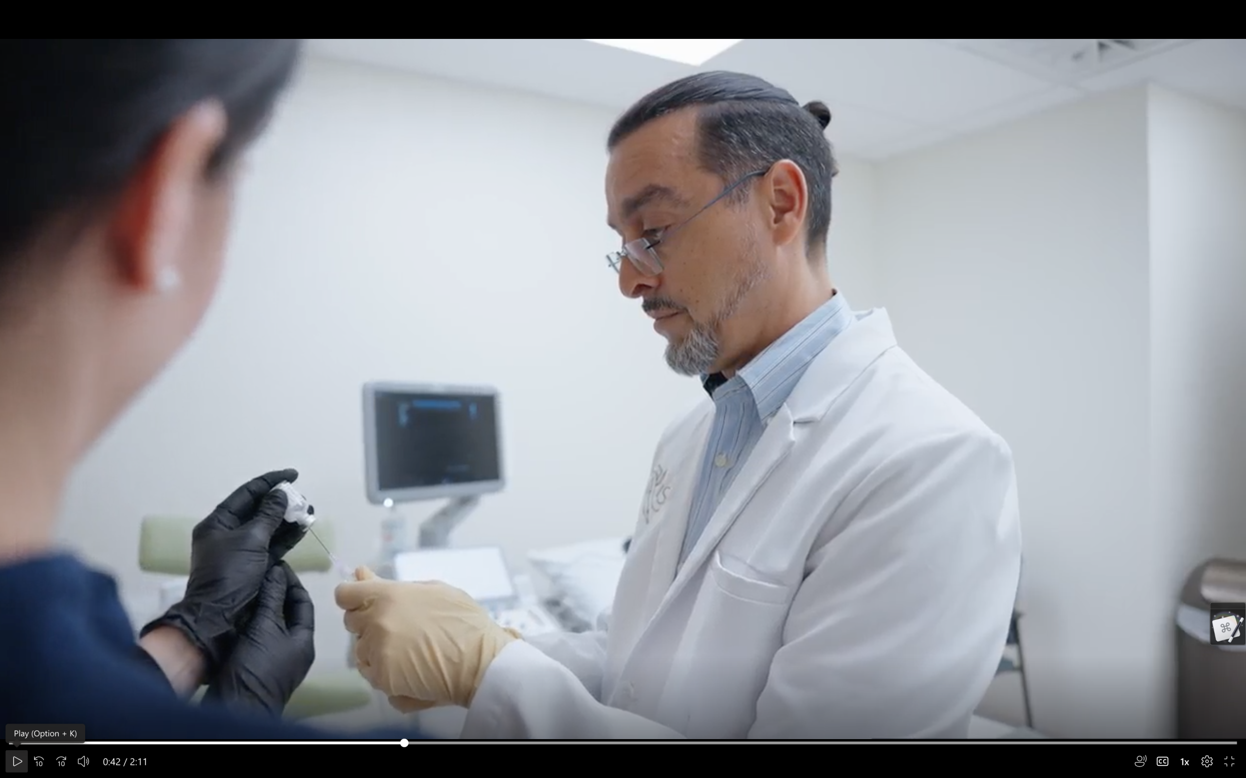 Dr. Khashy prepares for an ultrasound-guided injection at ISMI private pain clinic with assistance from clinical nurse